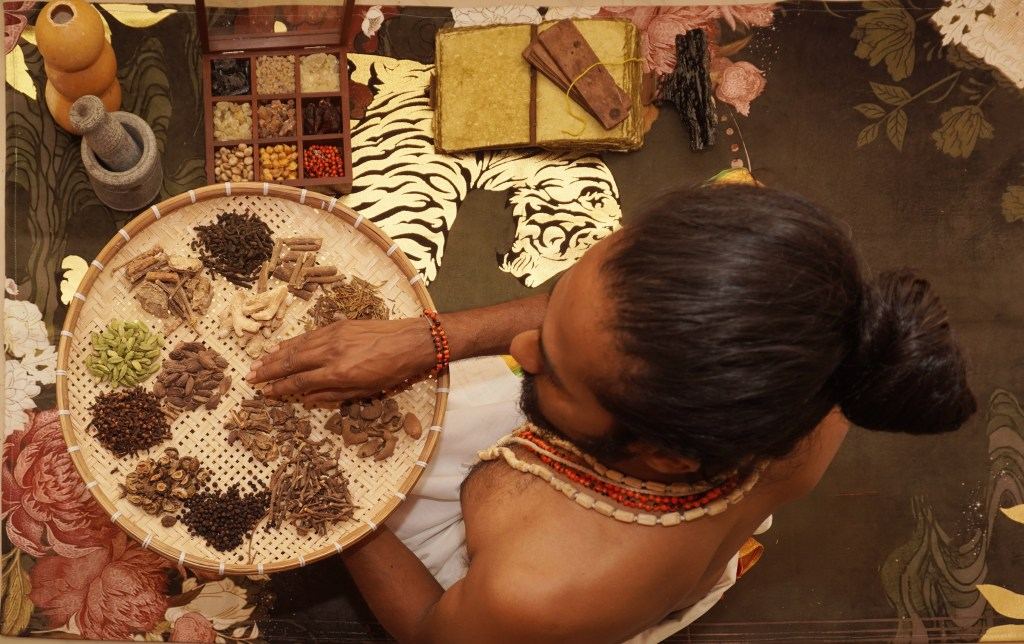 Sorting sacred herbs and resins by hand