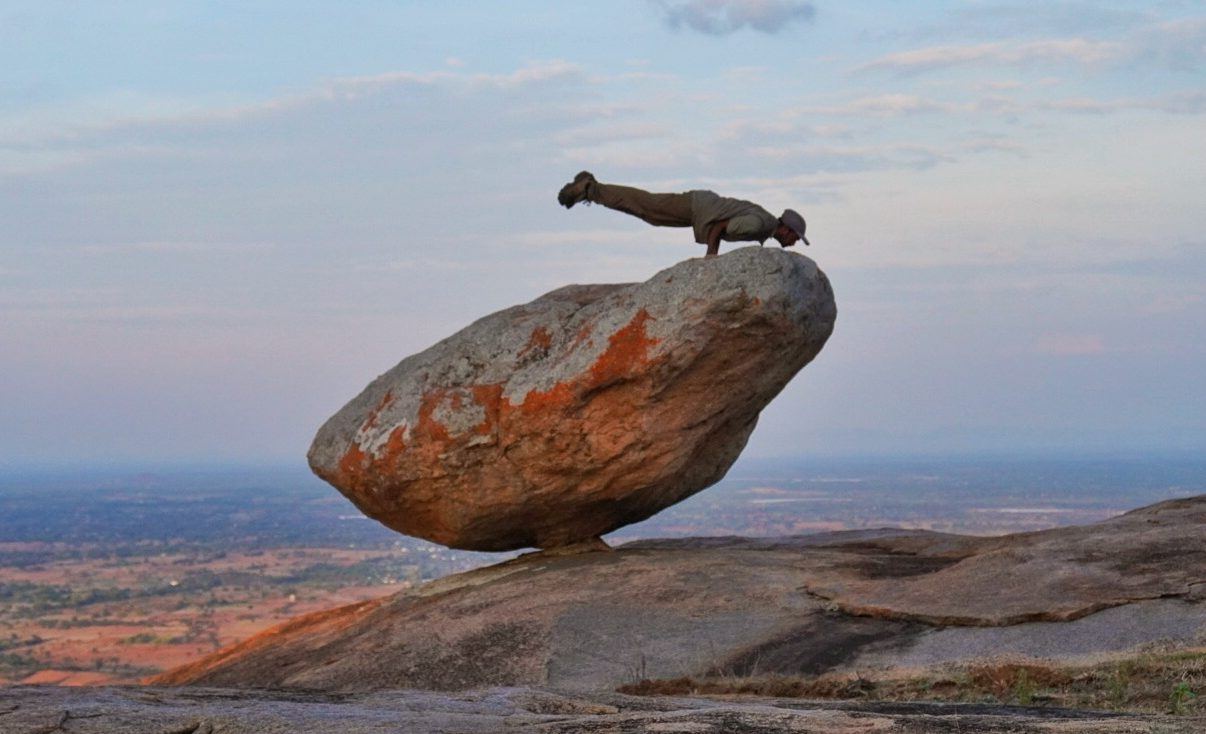 Mayurasana practiced on the boulders of Devarayanadurga